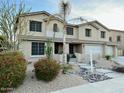 Two story house with desert landscaping and large driveway at 2311 E Coconino Dr, Chandler, AZ 85249