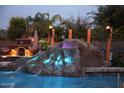 Night view of a gorgeous pool and waterfall at 2311 E Coconino Dr, Chandler, AZ 85249