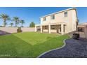 Large backyard with grassy area and gravel landscaping at 38318 N La Grange Ln, San Tan Valley, AZ 85140