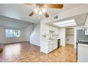 Open floor plan with kitchen, living room, and tile flooring at 222 W Brown Rd # 117, Mesa, AZ 85201