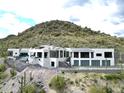 Luxury home nestled on a mountainside with stunning desert views at 4880 E Lone Mountain N Rd, Cave Creek, AZ 85331