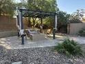 Charming patio with pergola, fire pit, and comfortable seating area at 1201 E Le Marche Ave, Phoenix, AZ 85022