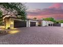 Three-car garage with paver driveway at 2346 E Sanoque Ct, Gilbert, AZ 85298
