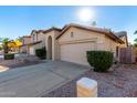 Two-story home with a large garage and neatly kept front yard at 3219 E Wickieup Ln, Phoenix, AZ 85050