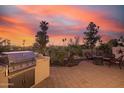 Backyard with built-in grill and fire pit, perfect for entertaining at 6202 E Mckellips Rd # 141, Mesa, AZ 85215