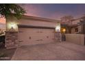 Two-car garage with brick facade and automatic door at 6202 E Mckellips Rd # 141, Mesa, AZ 85215