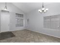 Spacious living room featuring tile floors and a view of the front door at 3473 E Bruce Ave, Gilbert, AZ 85234