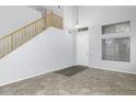 Bright entryway with tile flooring, staircase, and natural light at 3473 E Bruce Ave, Gilbert, AZ 85234