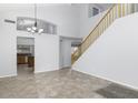 Spacious dining room with tile floors and kitchen view at 3473 E Bruce Ave, Gilbert, AZ 85234