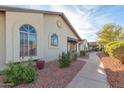 Attractive exterior of a house with a walkway and landscaping at 8140 N 107Th Ave # 129, Peoria, AZ 85345