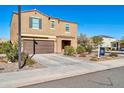 Two-story house with a brown facade, two-car garage, and landscaping at 12526 W Palmaire Ave, Glendale, AZ 85307