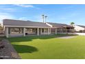 Spacious backyard with artificial turf and covered patio at 19039 N 90Th Ln, Peoria, AZ 85382