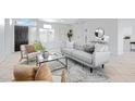 Bright living room featuring a neutral color palette and modern furniture at 19039 N 90Th Ln, Peoria, AZ 85382
