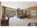 Spacious main bedroom with a large bed, patio access, and ample natural light at 1044 W Indian Hills Pl, Phoenix, AZ 85023