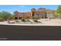 Beautiful two-story house with a long driveway and desert landscape at 1044 W Indian Hills Pl, Phoenix, AZ 85023