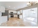 Bright kitchen featuring stainless steel appliances and tile flooring at 3743 W Dailey St, Phoenix, AZ 85053