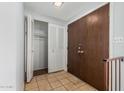 Clean entryway with tiled floors, double doors, and a closet at 8106 N 31St Dr, Phoenix, AZ 85051