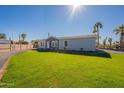 Newly built home with a well-maintained lawn and driveway at 249 N 89Th St, Mesa, AZ 85207
