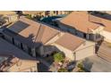 Single-story home with solar panels and a large backyard at 664 W Jardin Dr, Casa Grande, AZ 85122