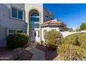 Front entrance with walkway, landscaping, and double door at 9382 E Aster Dr, Scottsdale, AZ 85260