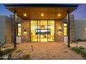 Stunning entryway with stone accents and glass doors at 9940 E Aleka Way, Scottsdale, AZ 85262