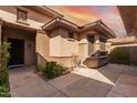 Private courtyard entry with mature plants and flagstone at 20972 N Canyon Whisper Dr, Surprise, AZ 85387