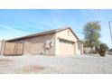 Single car garage with neutral colored door at 25422 W Maldonado Ct, Buckeye, AZ 85326