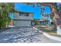 Front view of a remodeled home with a large yard and driveway at 6312 N 13Th St, Phoenix, AZ 85014