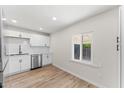 Modern kitchen with white shaker cabinets and stainless steel appliances at 725 W Cinnabar Ave, Phoenix, AZ 85021