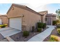 Front view of the house, showing garage and walkway at 846 N Pueblo Dr # 113, Casa Grande, AZ 85122