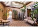 Relaxing courtyard with seating area and fountain at 12832 W Pinnacle Vista Dr, Peoria, AZ 85383