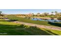 Golf course with pond and palm trees at 12832 W Pinnacle Vista Dr, Peoria, AZ 85383