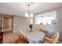 Dining room with a view into the kitchen and entryway at 13652 W Fargo Dr, Surprise, AZ 85374