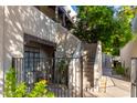 Condo exterior with gated entrance and walkway at 1449 E Highland Ave # 36, Phoenix, AZ 85014