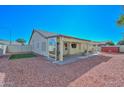 Covered patio, artificial turf, gravel yard and storage shed at 20058 N 109Th Dr, Sun City, AZ 85373