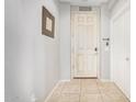 Bright entryway with tiled floor and a white door at 4102 S 186Th Ave, Goodyear, AZ 85338