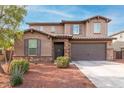 Two-story house with stone accents and a large garage at 4102 S 186Th Ave, Goodyear, AZ 85338