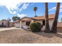 Single story home with a two-car garage and desert landscaping at 2325 E Hermosa Dr, Tempe, AZ 85282