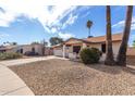 Single story home with a two-car garage and desert landscaping at 2325 E Hermosa Dr, Tempe, AZ 85282