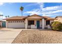 Single story home with a two-car garage and desert landscaping at 2325 E Hermosa Dr, Tempe, AZ 85282