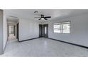 Bright living room featuring tile floors and ceiling fan at 17842 N 43Rd St, Phoenix, AZ 85032