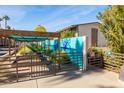 Community garden with covered seating and colorful mural at 4701 N 68Th St # 248, Scottsdale, AZ 85251