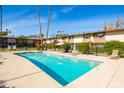 Refreshing community pool with surrounding patio furniture at 4701 N 68Th St # 248, Scottsdale, AZ 85251