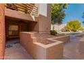Exterior view of building entrance with landscaping at 1340 N Recker Rd # 140, Mesa, AZ 85205
