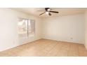 Bright bedroom with tile floors and ceiling fan at 8027 N 32Nd Ave, Phoenix, AZ 85051