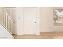 Clean entryway with tiled floors, a door, and stairway at 8027 N 32Nd Ave, Phoenix, AZ 85051