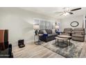 Relaxing living room with a neutral color scheme, hardwood floors, and comfortable seating at 8302 E Wilshire Dr, Scottsdale, AZ 85257