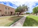 Aerial view of a condo complex with green lawns and walkways at 8428 N 33Rd Dr, Phoenix, AZ 85051