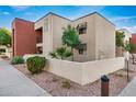 Building exterior showcasing landscaping and architectural details at 1340 N Recker Rd # 256, Mesa, AZ 85205