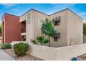Building exterior showcasing landscaping and architectural details at 1340 N Recker Rd # 256, Mesa, AZ 85205